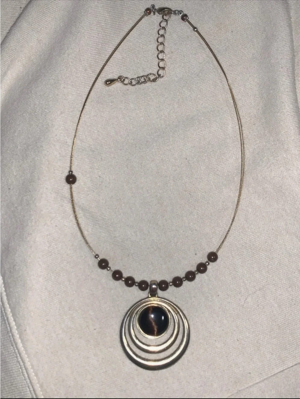 Elegant Brown Bead Necklace with Concentric Pendant